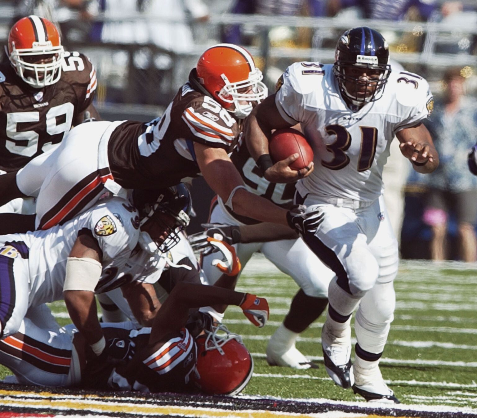 2003: Baltimore's Jamal Lewis rushes for an NFL-record 295 yards